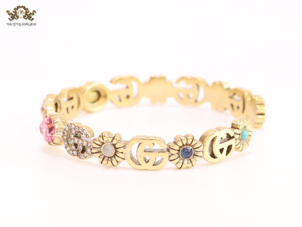 Double G cz with pink stone open gold bracelet