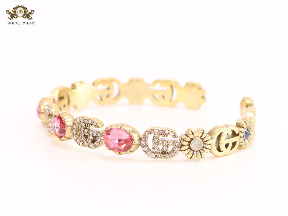 Double G cz with pink stone open gold bracelet