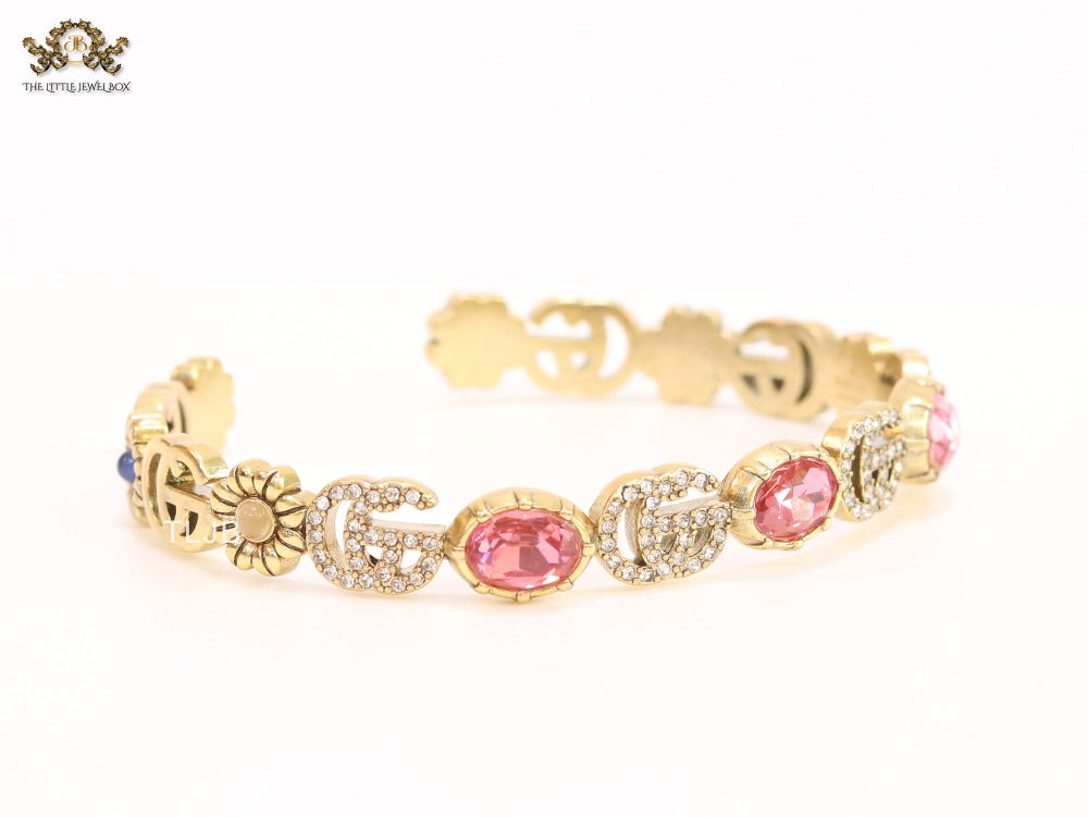 Double G cz with pink stone open gold bracelet