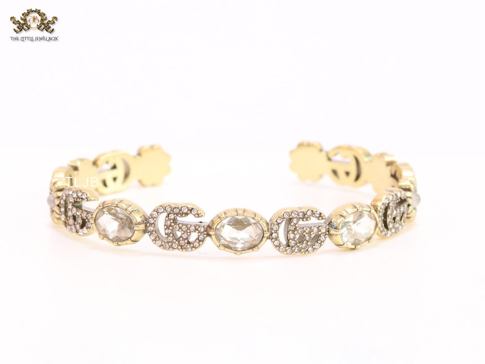 Double G cz with stone open gold bracelet