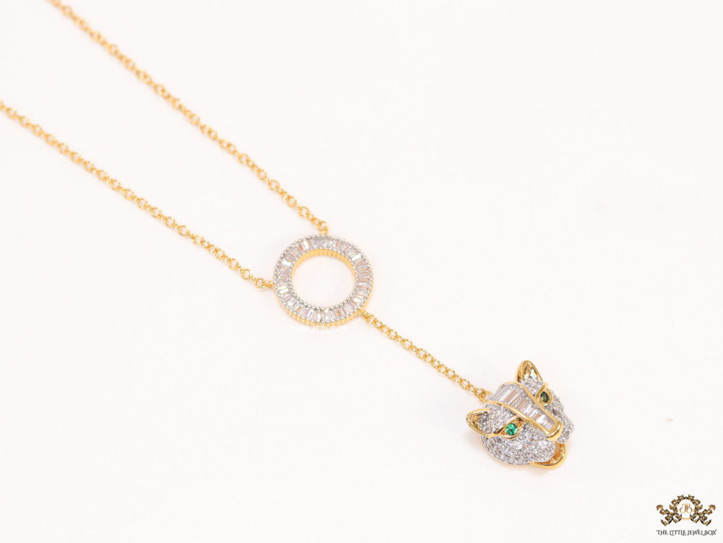 Gold plated sleek chain with circular cubic zirconia disk and gold plated panther face motif pendant