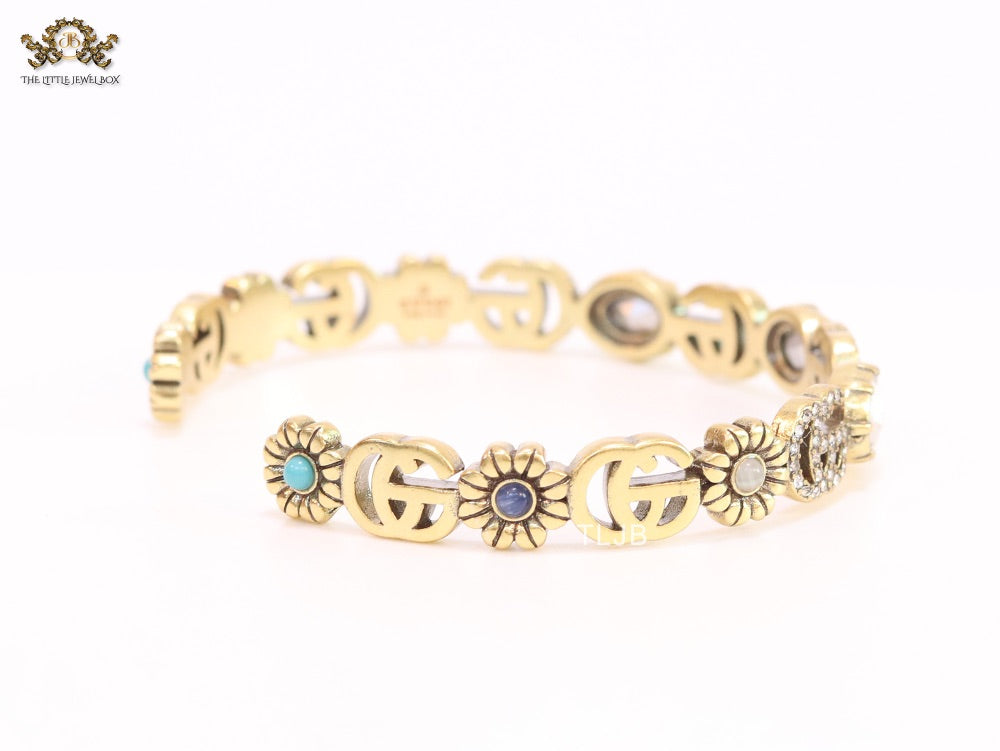 Double G cz with stone open gold bracelet