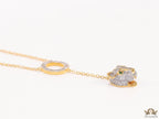 Gold plated sleek chain with circular cubic zirconia disk and gold plated panther face motif pendant