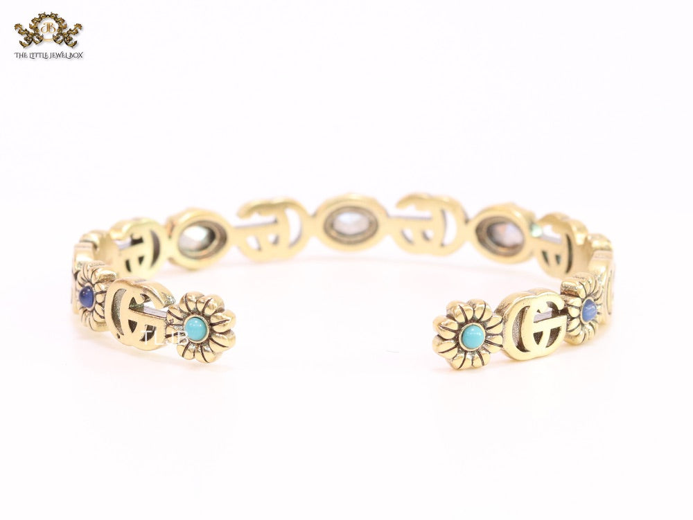 Double G cz with stone open gold bracelet
