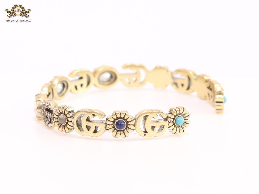 Double G cz with stone open gold bracelet
