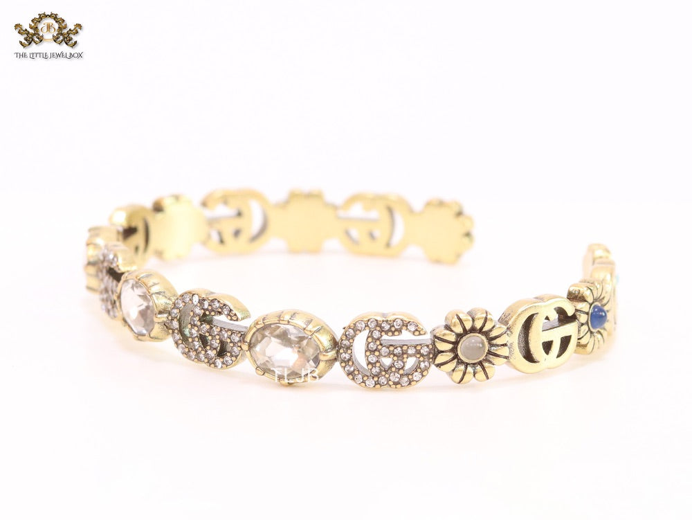 Double G cz with stone open gold bracelet