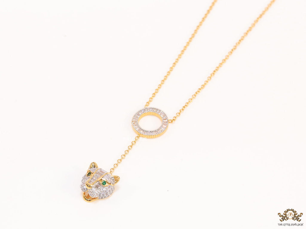 Gold plated sleek chain with circular cubic zirconia disk and gold plated panther face motif pendant