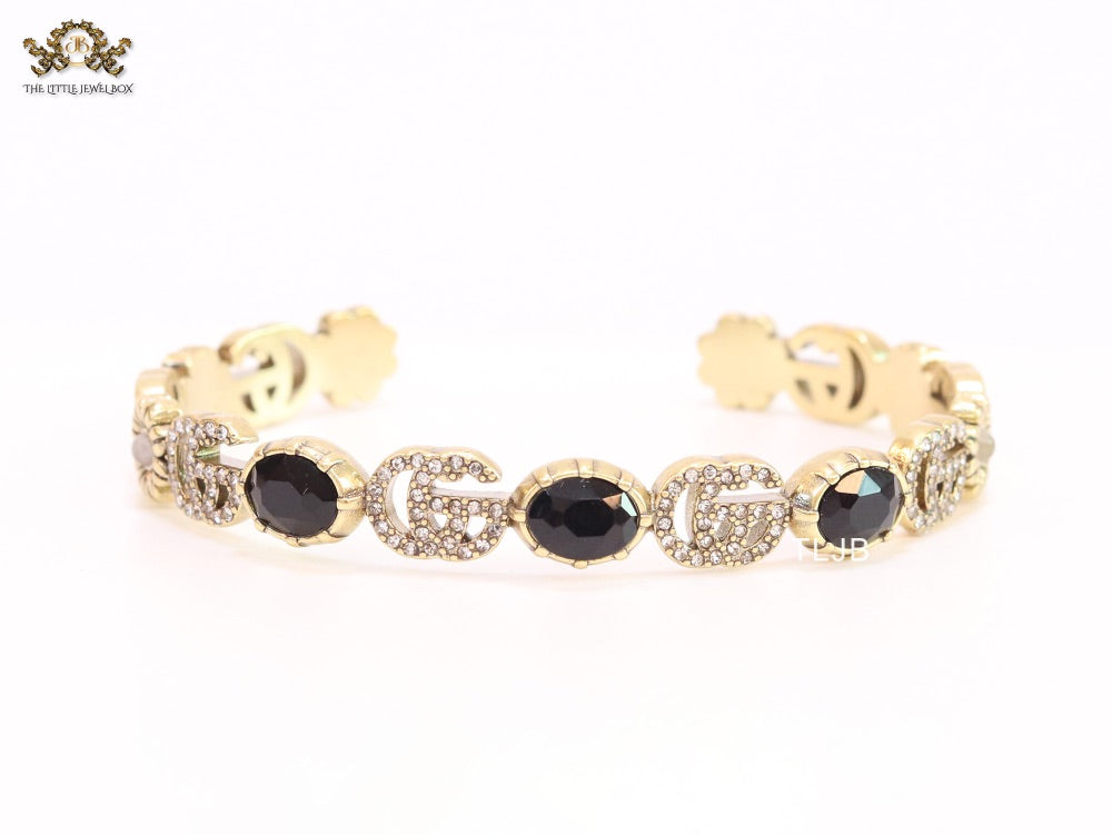 Double G cz with black stone open gold bracelet