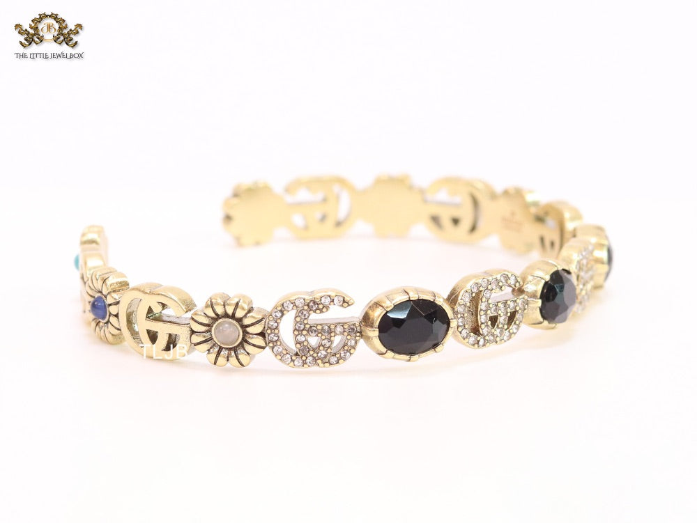 Double G cz with black stone open gold bracelet