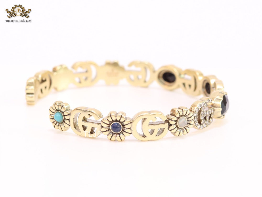 Double G cz with black stone open gold bracelet