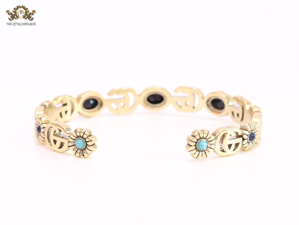 Double G cz with black stone open gold bracelet