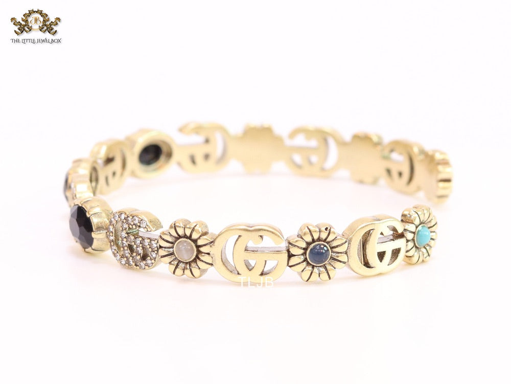Double G cz with black stone open gold bracelet