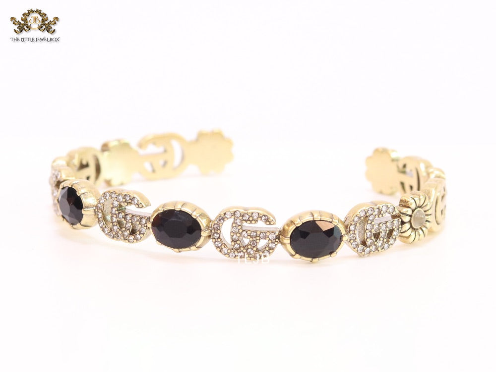 Double G cz with black stone open gold bracelet