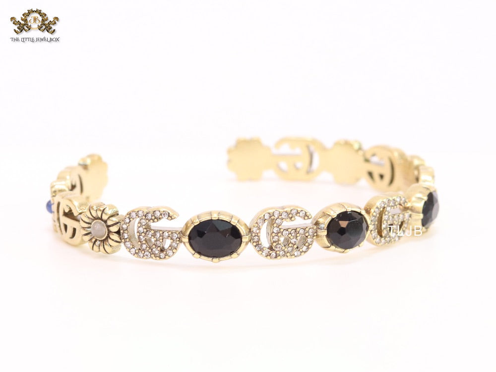 Double G cz with black stone open gold bracelet