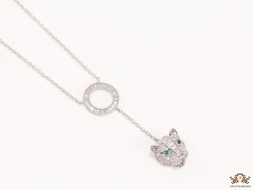 Platinum plated sleek chain with circular cubic zirconia disk and Platinum plated panther face motif pendant