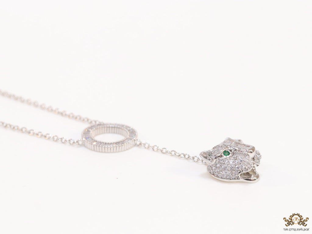 Platinum plated sleek chain with circular cubic zirconia disk and Platinum plated panther face motif pendant