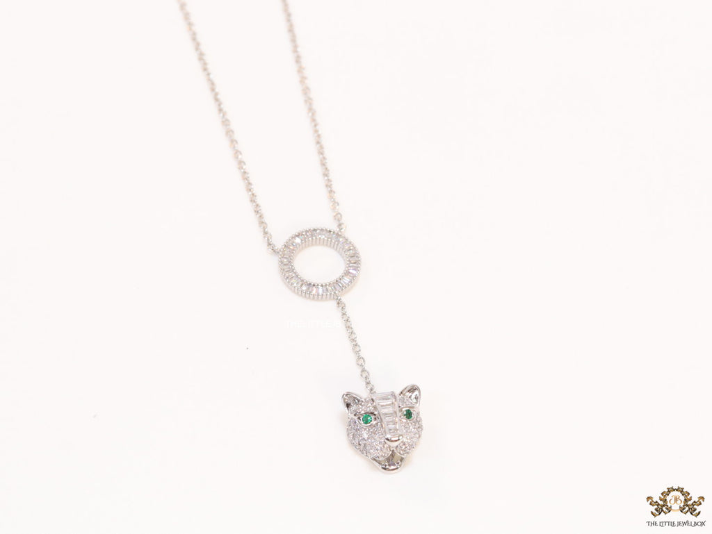 Platinum plated sleek chain with circular cubic zirconia disk and Platinum plated panther face motif pendant