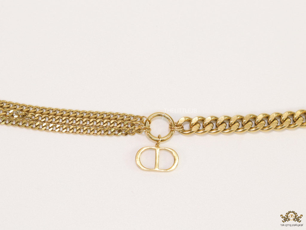 Multiple chain golden bracelet with C and D alphabets