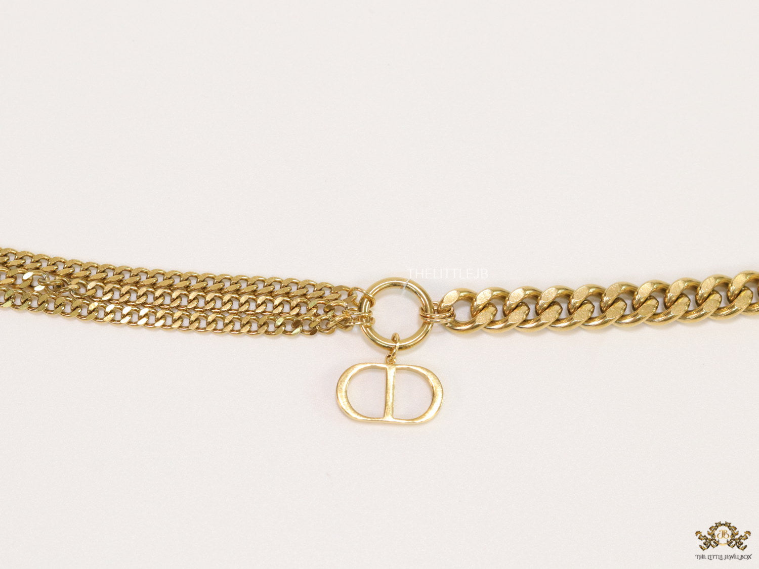 Multiple chain golden bracelet with C and D alphabets