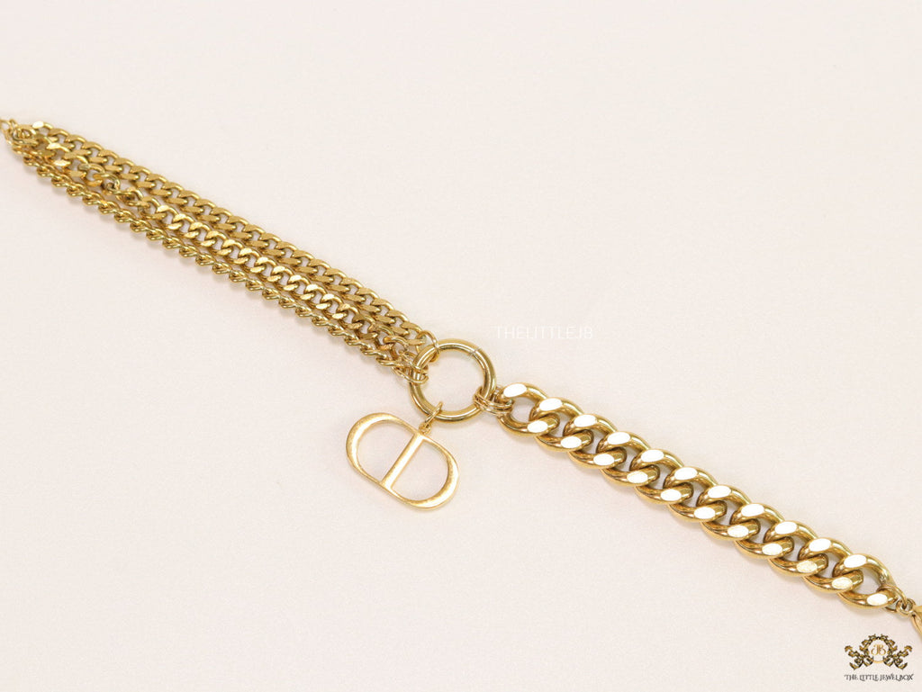 Multiple chain golden bracelet with C and D alphabets