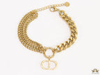 Multiple chain golden bracelet with C and D alphabets