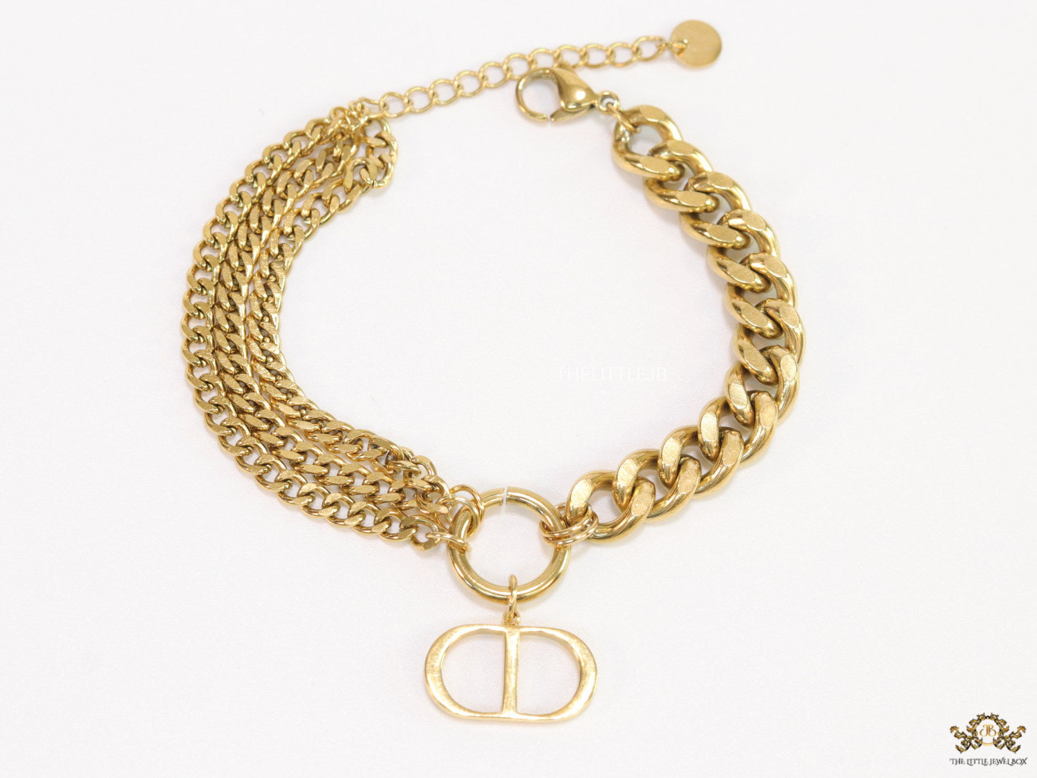 Multiple chain golden bracelet with C and D alphabets