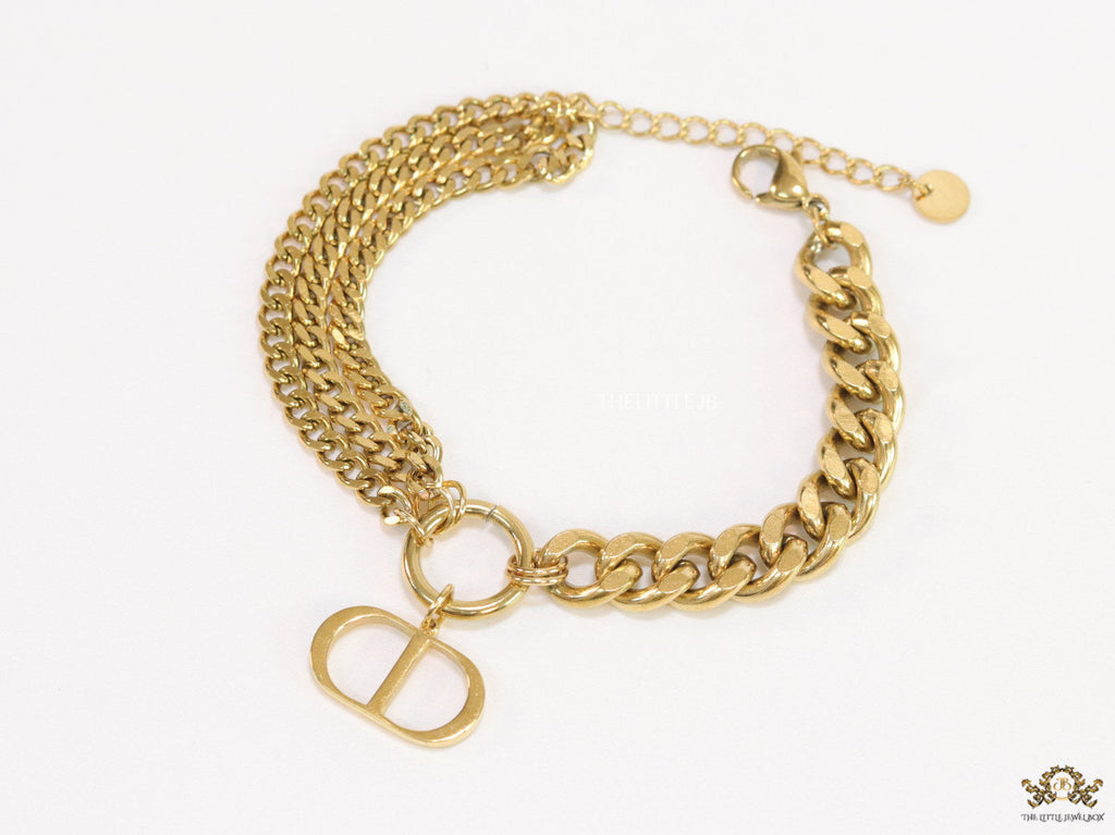 Multiple chain golden bracelet with C and D alphabets