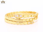 Gold triple layered snake bracelet with cz