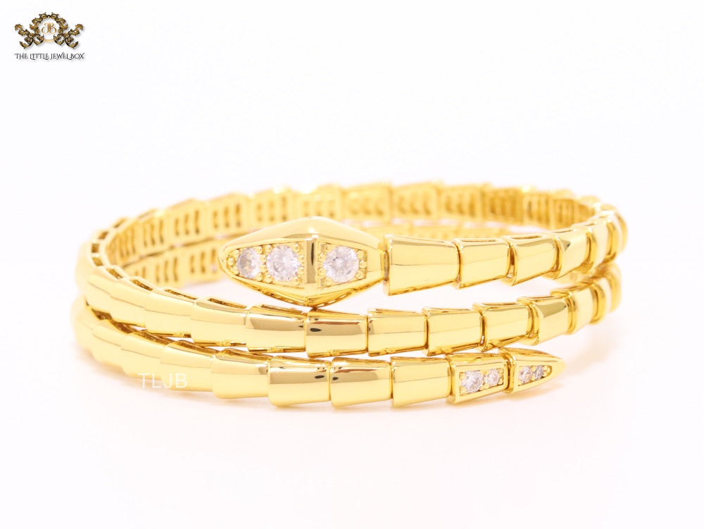 Gold triple layered serpentine bracelet with cz