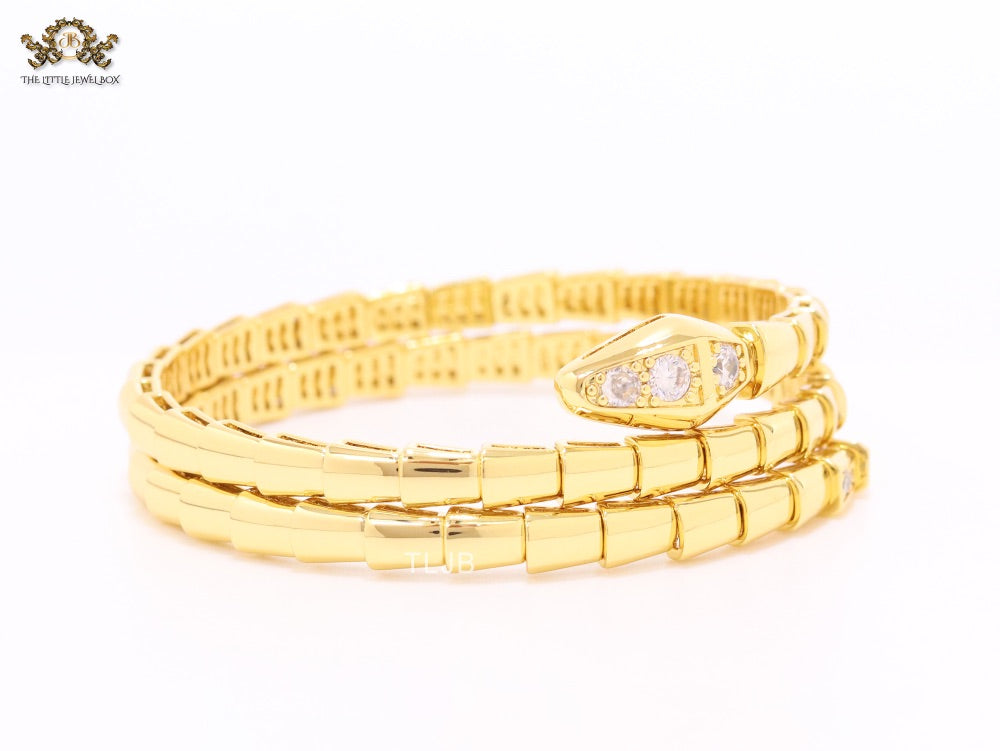 Gold triple layered snake bracelet with cz