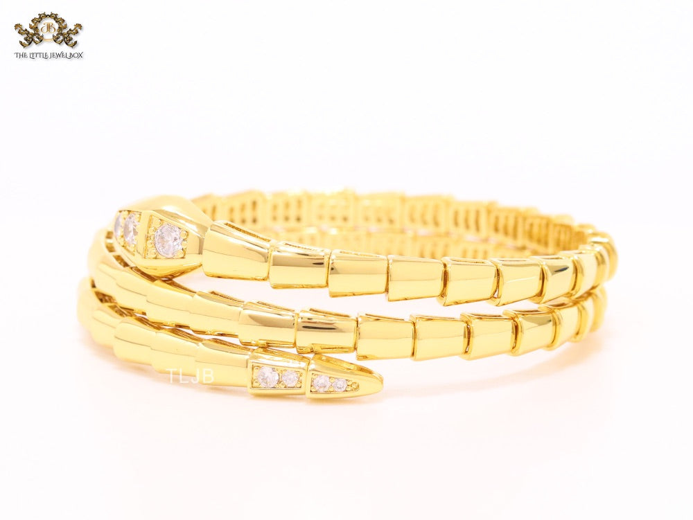 Gold triple layered snake bracelet with cz
