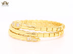 Gold triple layered serpentine bracelet with cz