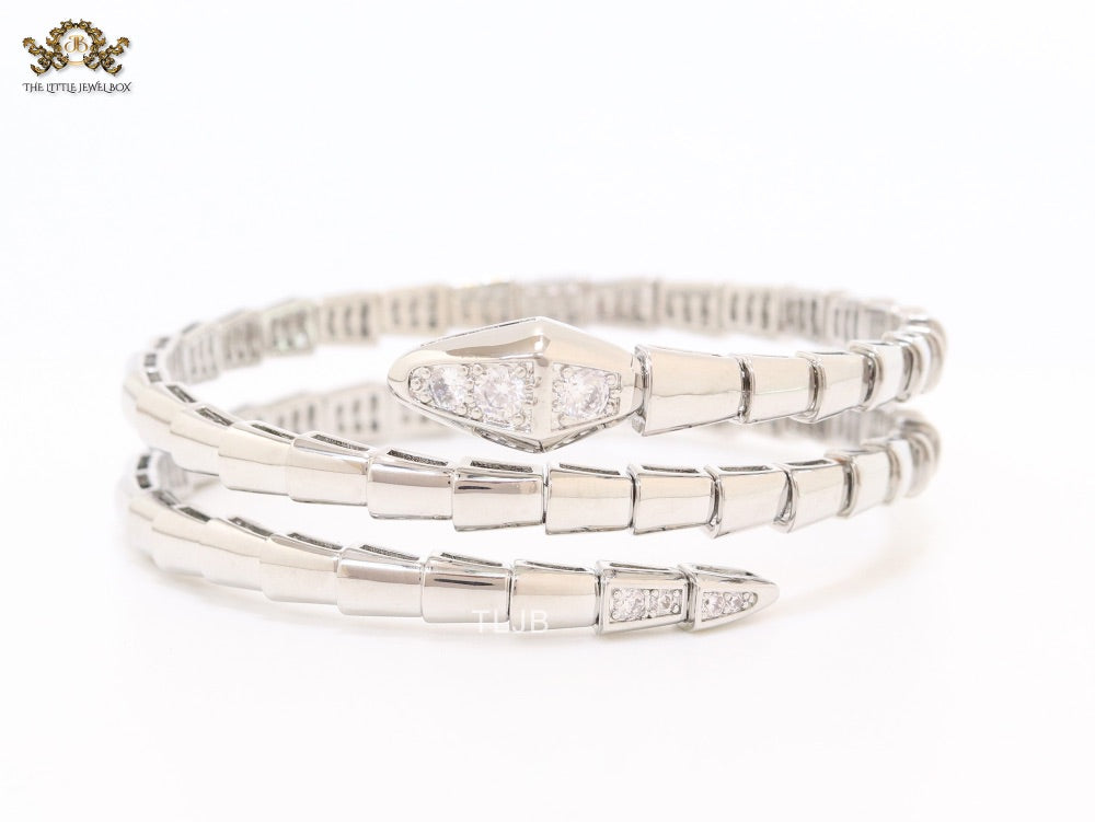 Platinum triple layered serpentine bracelet with cz