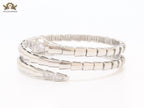 Platinum triple layered serpentine bracelet with cz