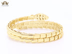 Gold triple layered serpentine bracelet with cz
