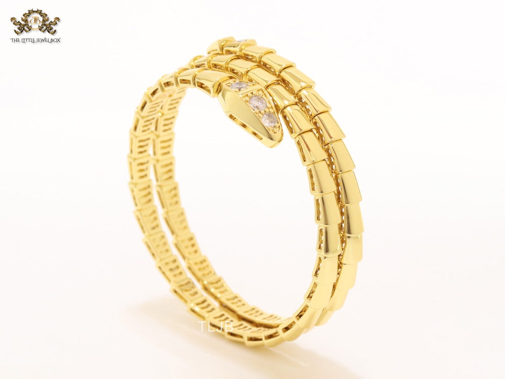 Gold triple layered snake bracelet with cz