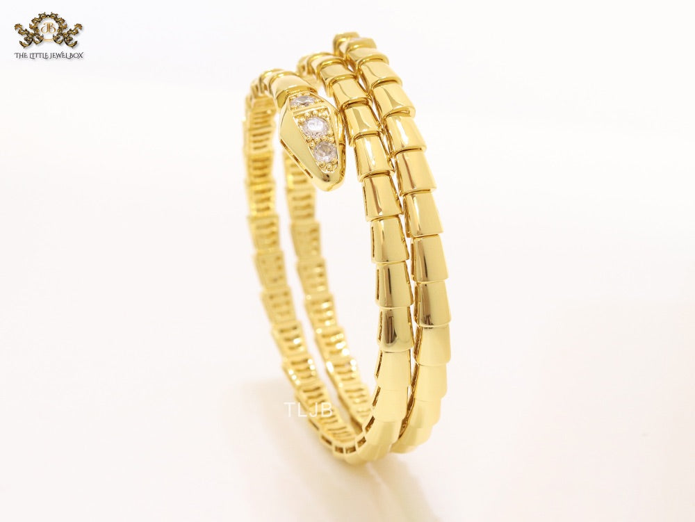 Gold triple layered snake bracelet with cz