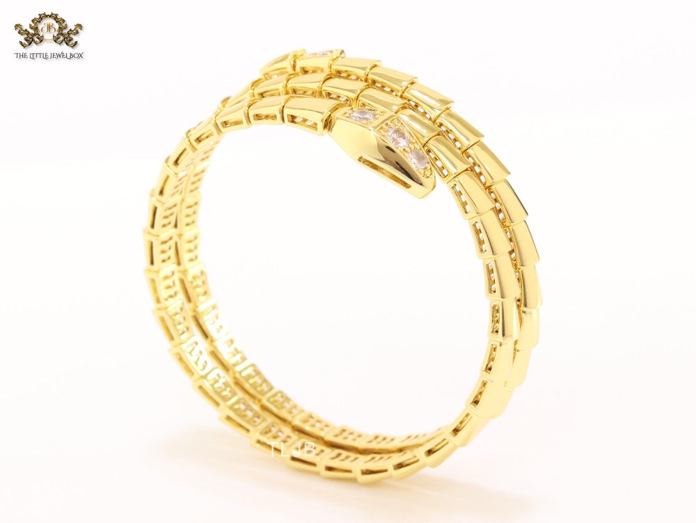 Gold triple layered serpentine bracelet with cz
