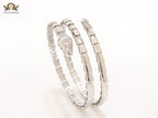 Platinum triple layered serpentine bracelet with cz
