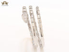 Platinum triple layered serpentine bracelet with cz