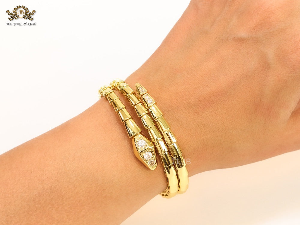 Gold triple layered serpentine bracelet with cz