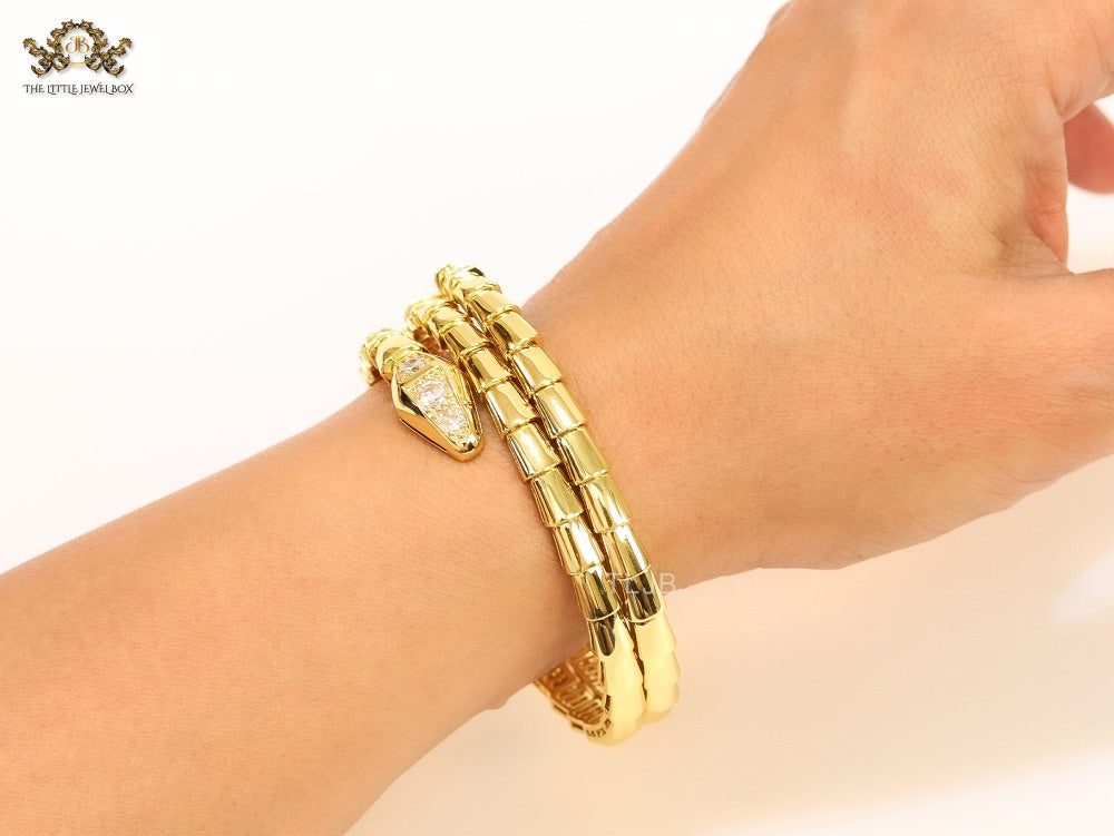 Gold triple layered snake bracelet with cz
