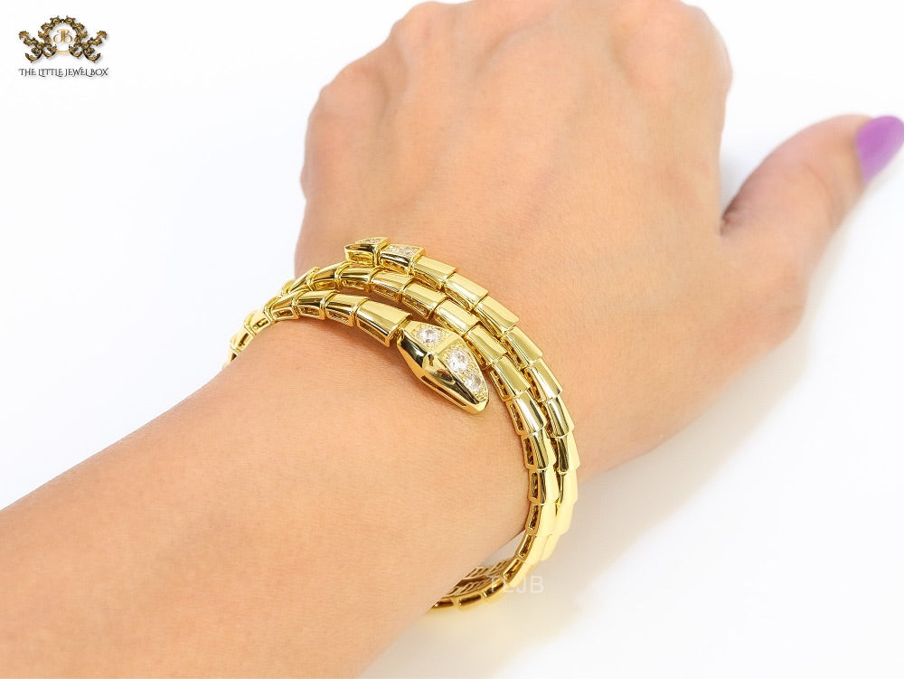 Gold triple layered snake bracelet with cz