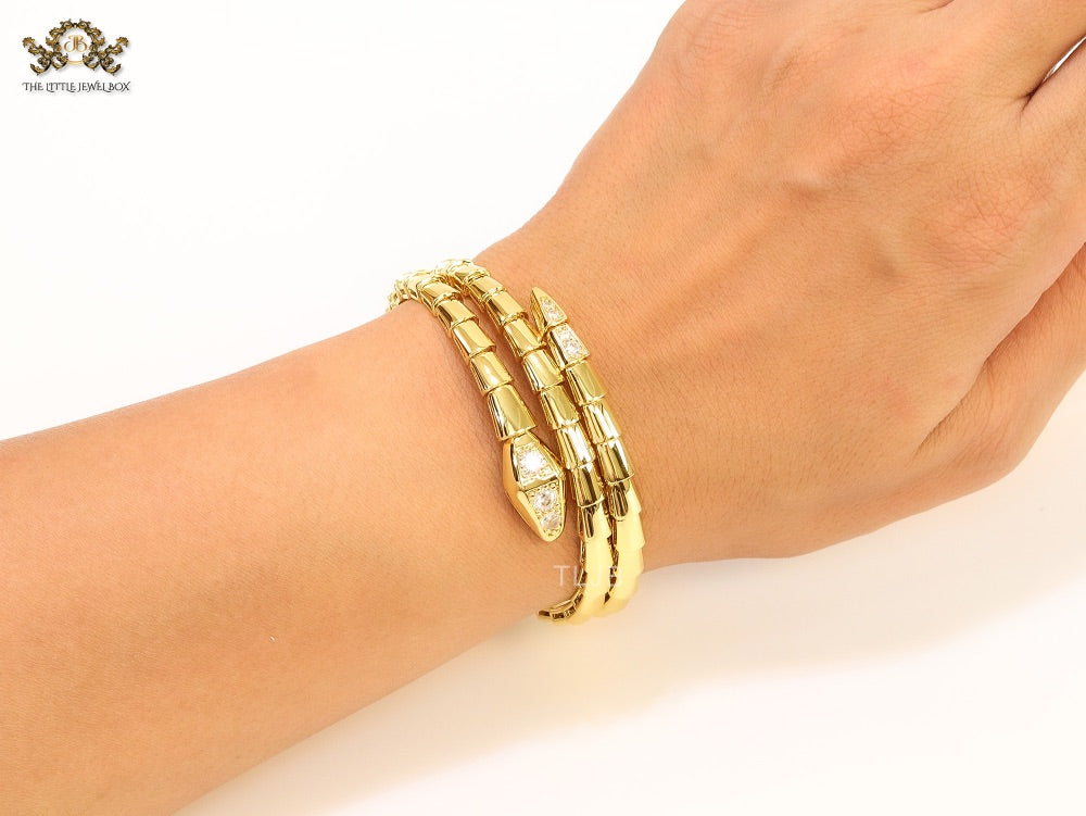Gold triple layered serpentine bracelet with cz