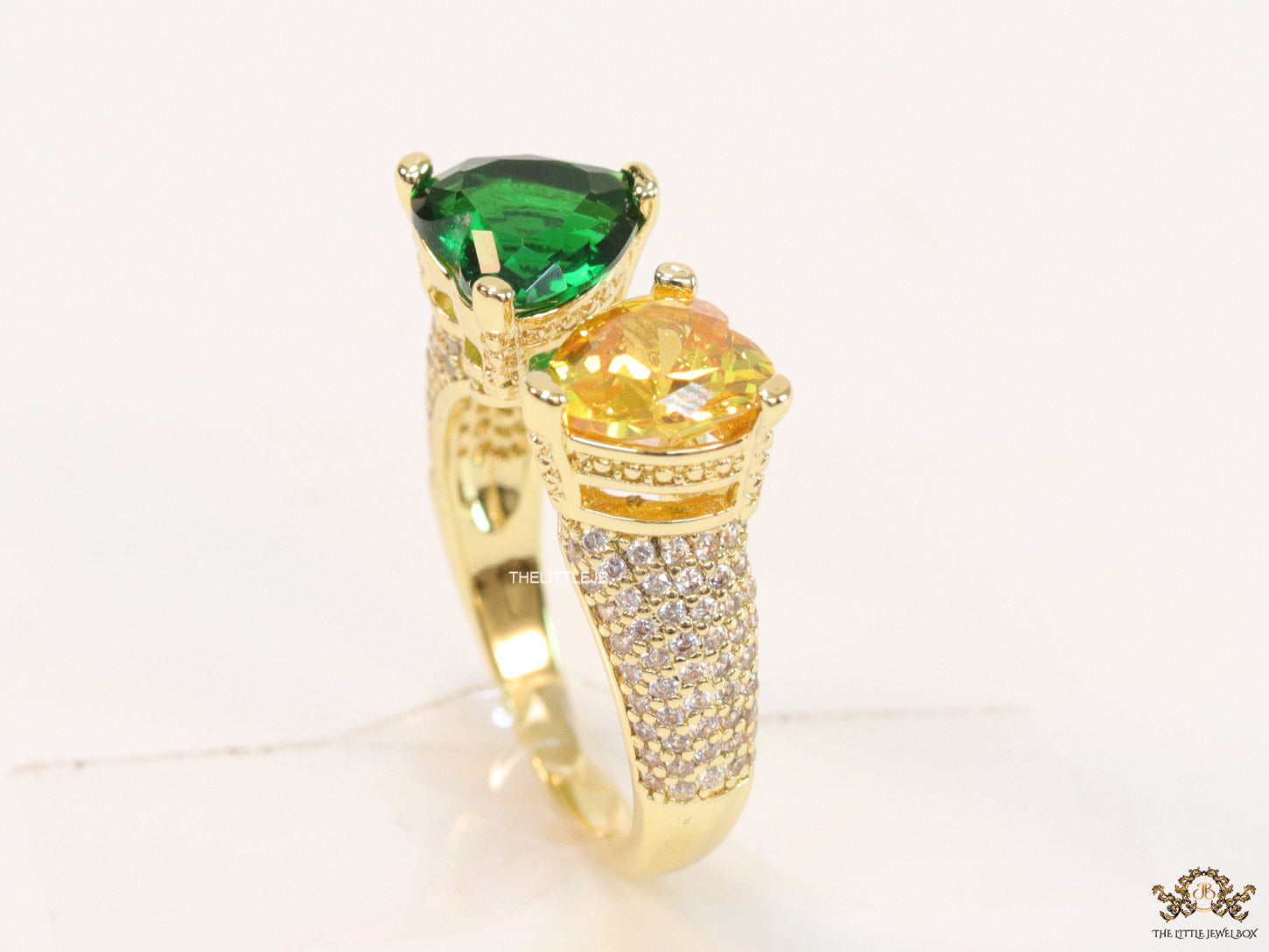 Open gold ring with twin hearts