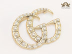 Double G pearl & gold brooch