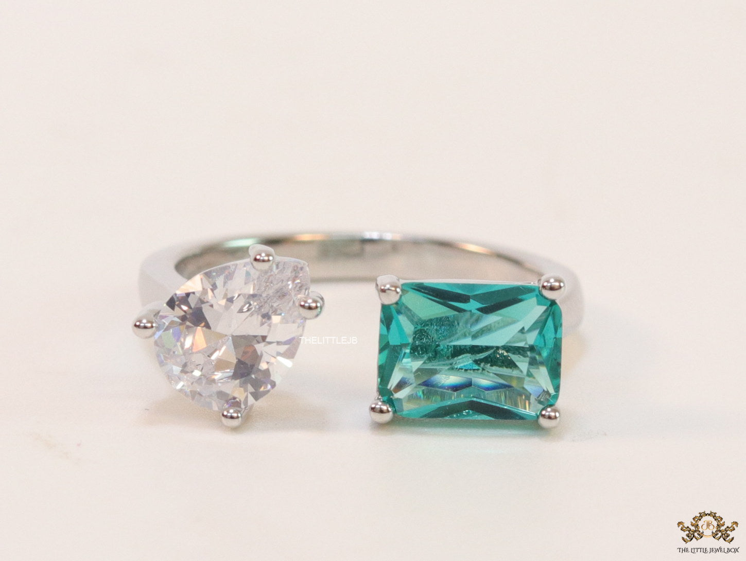 Top open rose gold ring with two asymmetrical czs