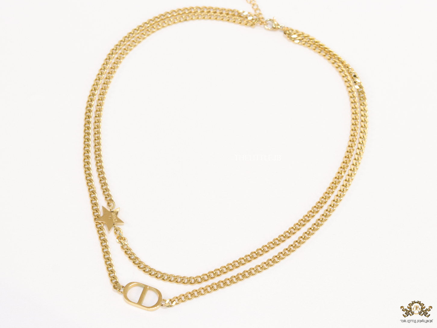 Dual chain necklace with alphabet and star motif