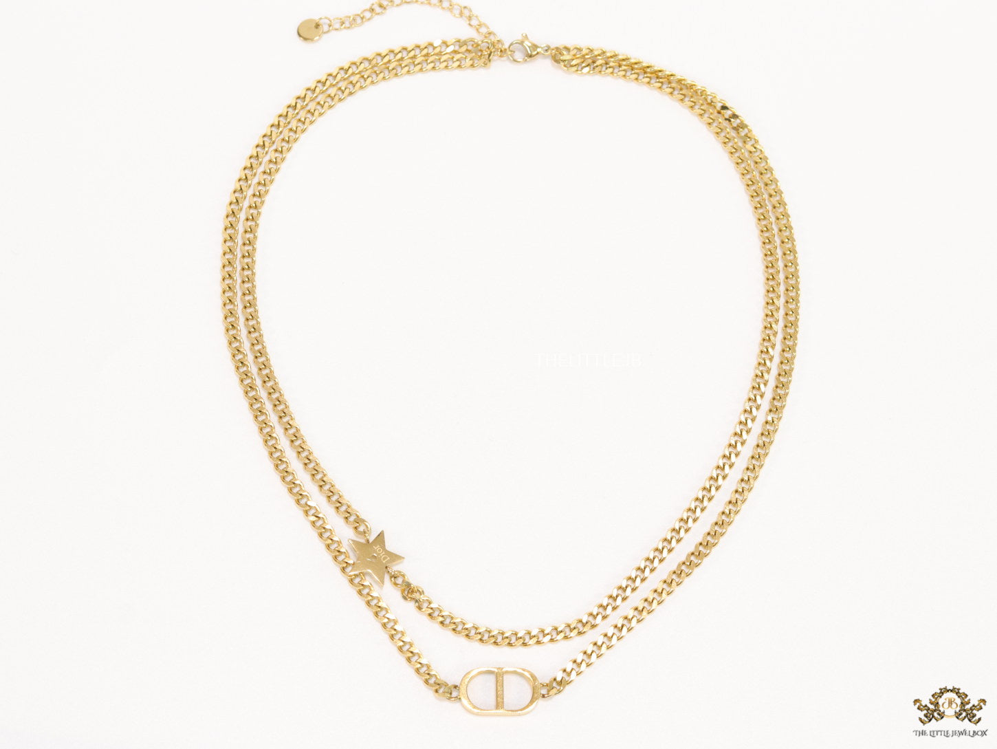 Dual chain necklace with alphabet and star motif