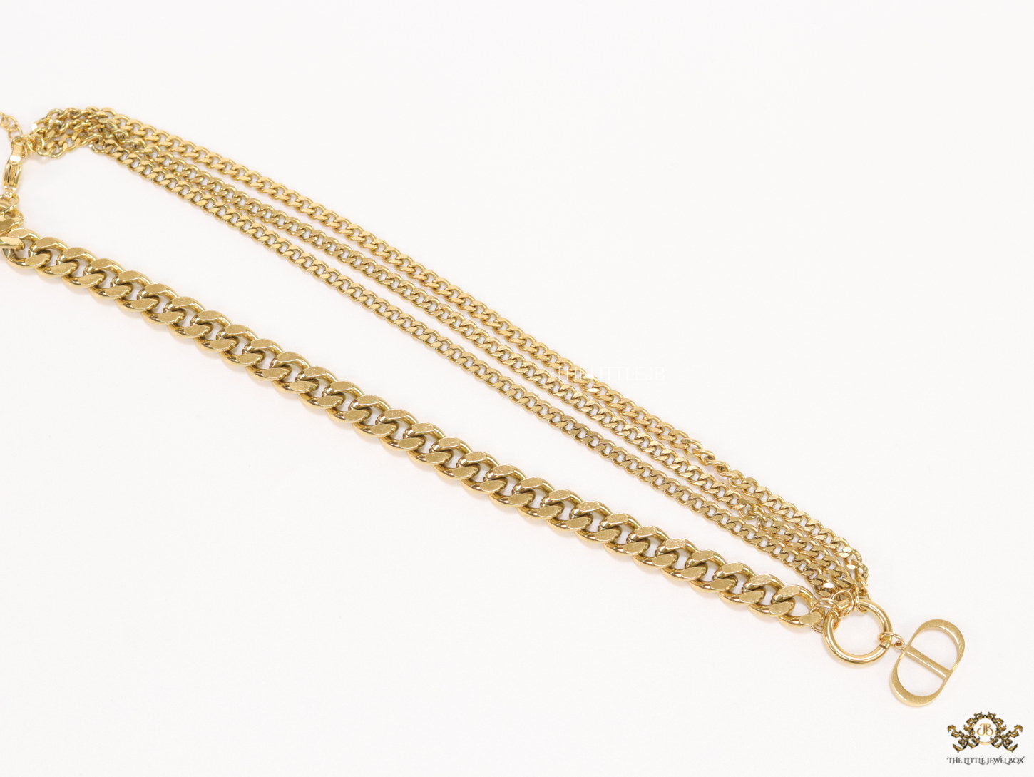 Multiple golden chain necklace with alphabet pendant